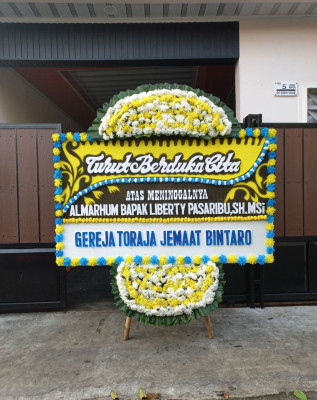 Papan Bunga Duka di Suradita